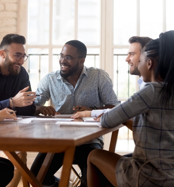 group of workers talking at table